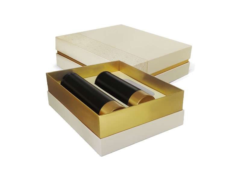 Elegant gift box with two black containers.